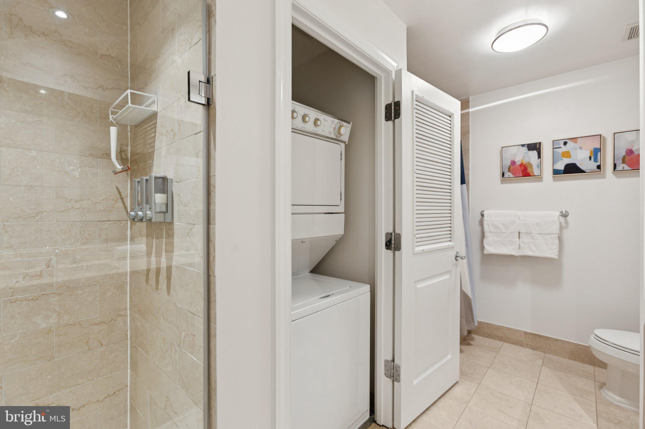2425 L Street Northwest, Unit 210 Washington, DC 20037 - Photo 23 of 39 a bathroom with a shower and toilet