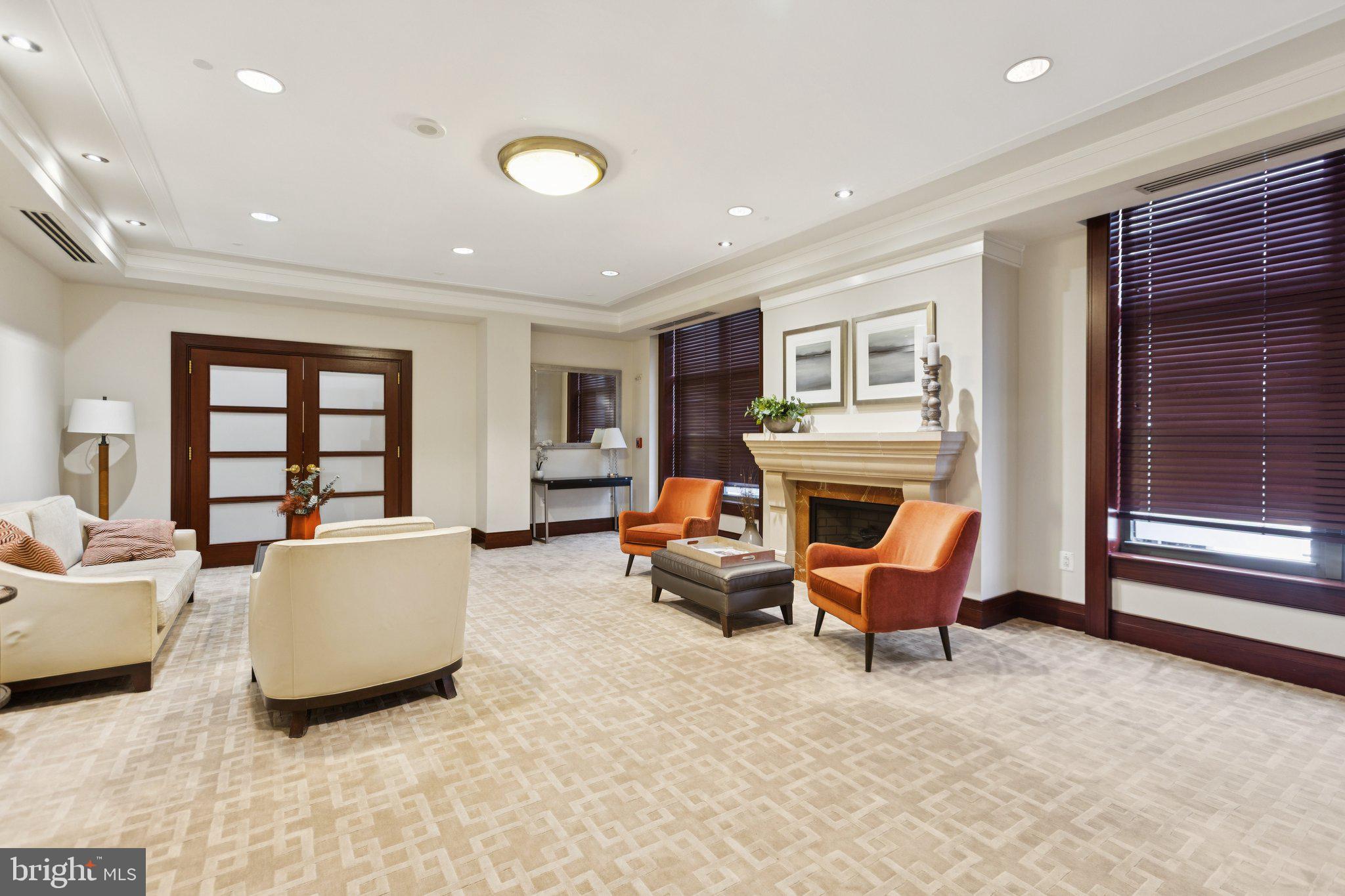 2425 L Street Northwest, Unit 210 Washington, DC 20037 - Photo 37 of 39 a living room with furniture and a fireplace