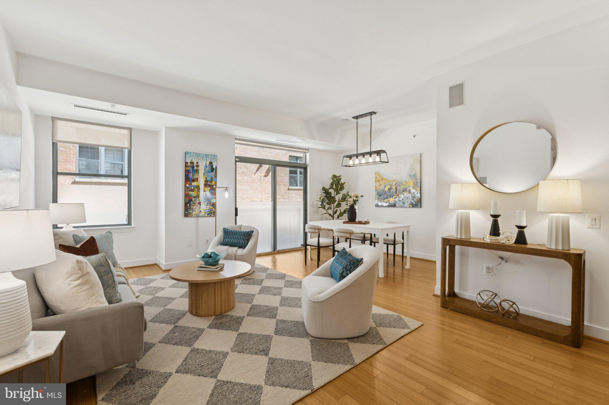 2425 L Street Northwest, Unit 210 Washington, DC 20037 - Photo 6 of 39 a living room with furniture a dining table and a window