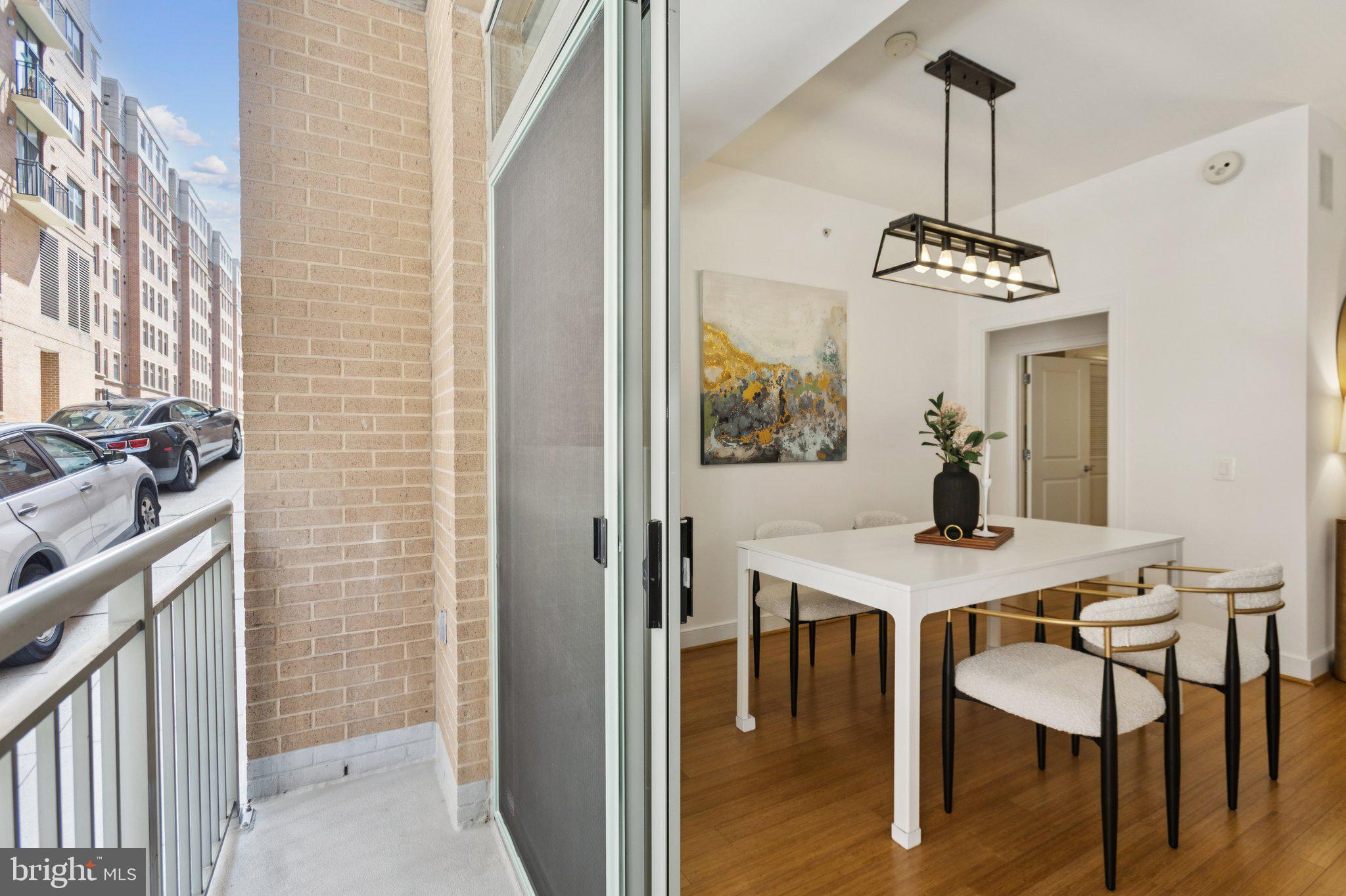 2425 L Street Northwest, Unit 210 Washington, DC 20037 - Photo 10 of 39 a view of a dining room with furniture window and wooden floor