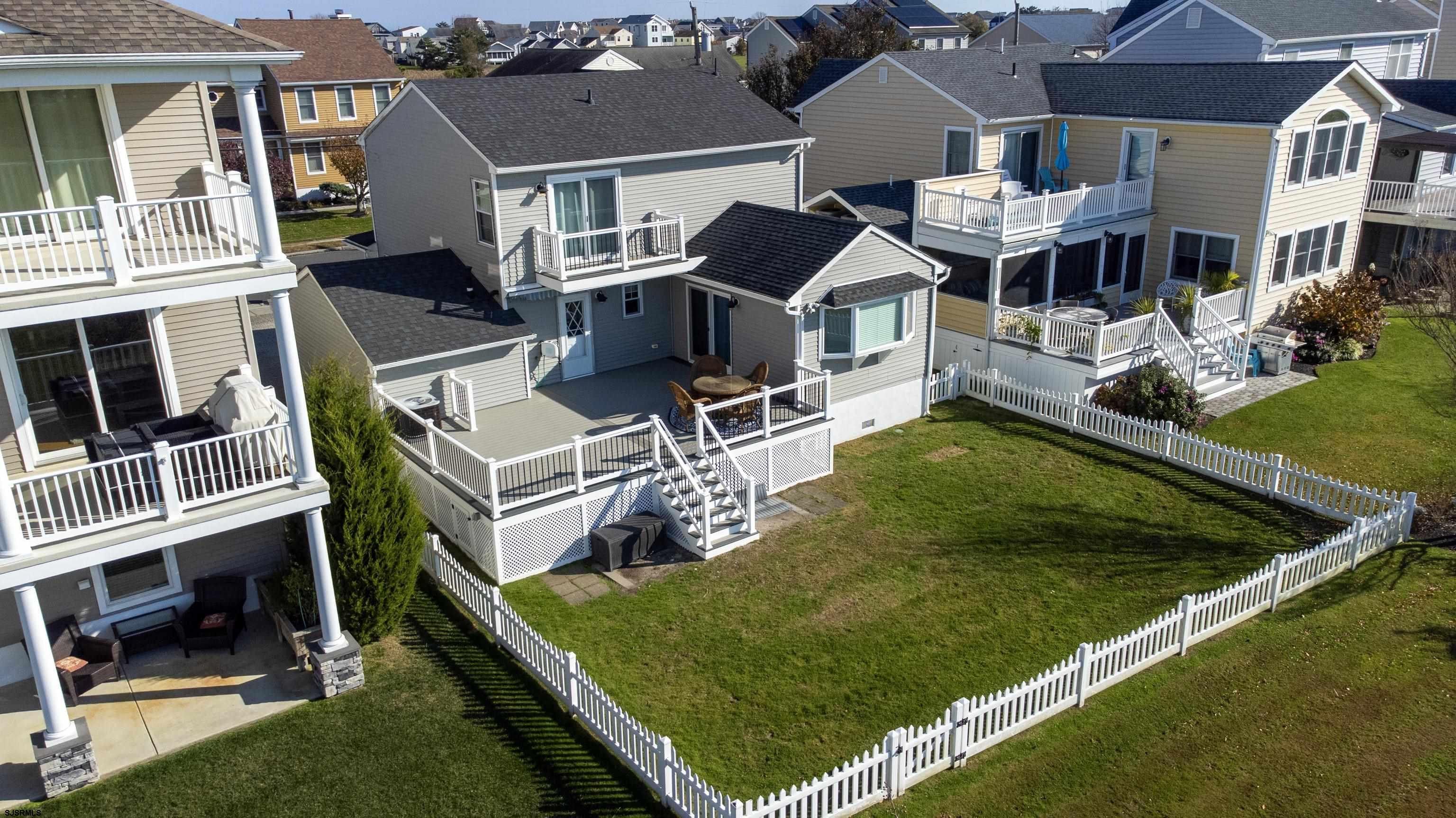 214 Hagen Road Brigantine, NJ 08203 - Photo 31 of 34 an aerial view of a house with swimming pool and a yard