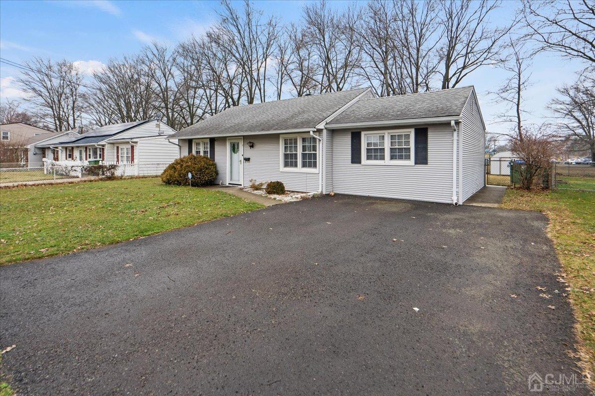 5 Glenville Road Edison, NJ 08817 - Photo 3 of 32 a front view of a house with a yard and garage