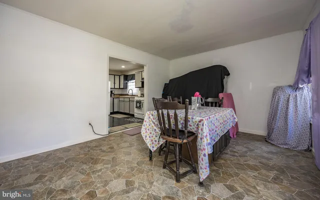 a bedroom with furniture and a dresser