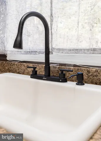a kitchen with stainless steel appliances a refrigerator sink and cabinets