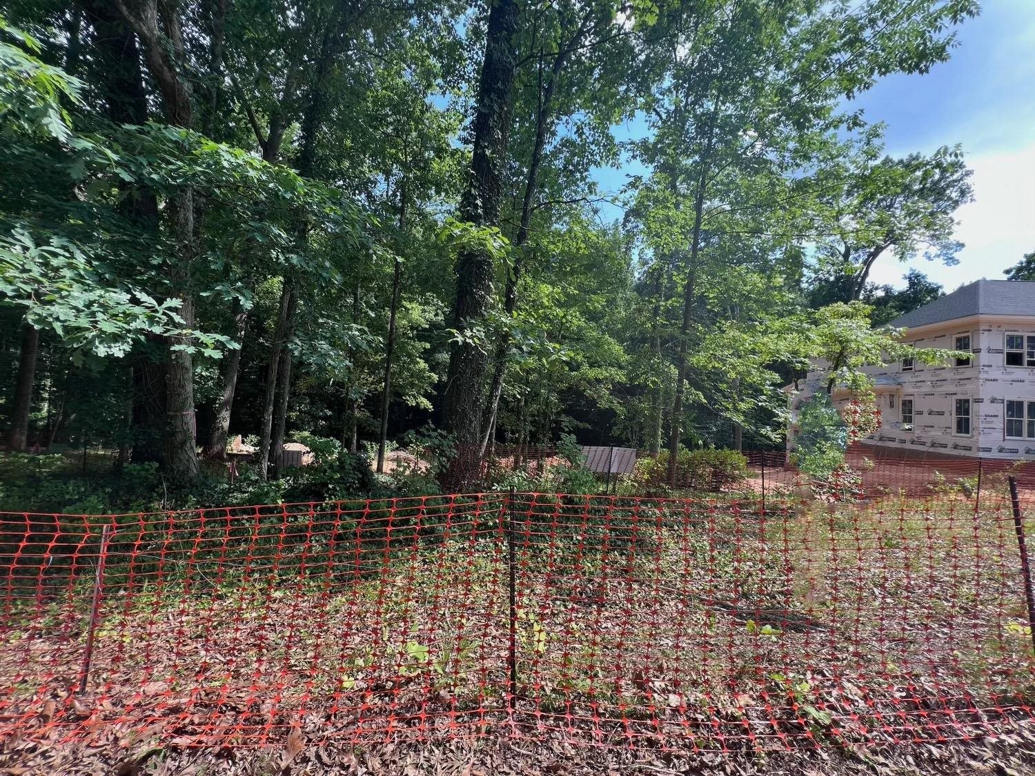 204 Pasquotank Drive Raleigh, NC 27608 - Photo 2 of 4 a view of a yard with plants and trees