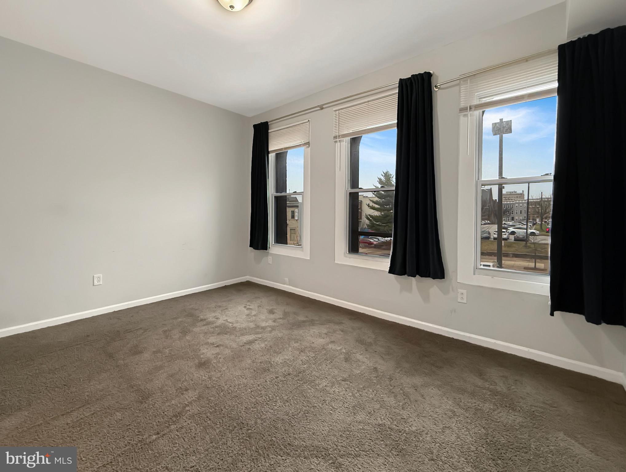 135 East North Avenue, Unit 2 Baltimore, MD 21202 - Photo 12 of 29 en empty room with window
