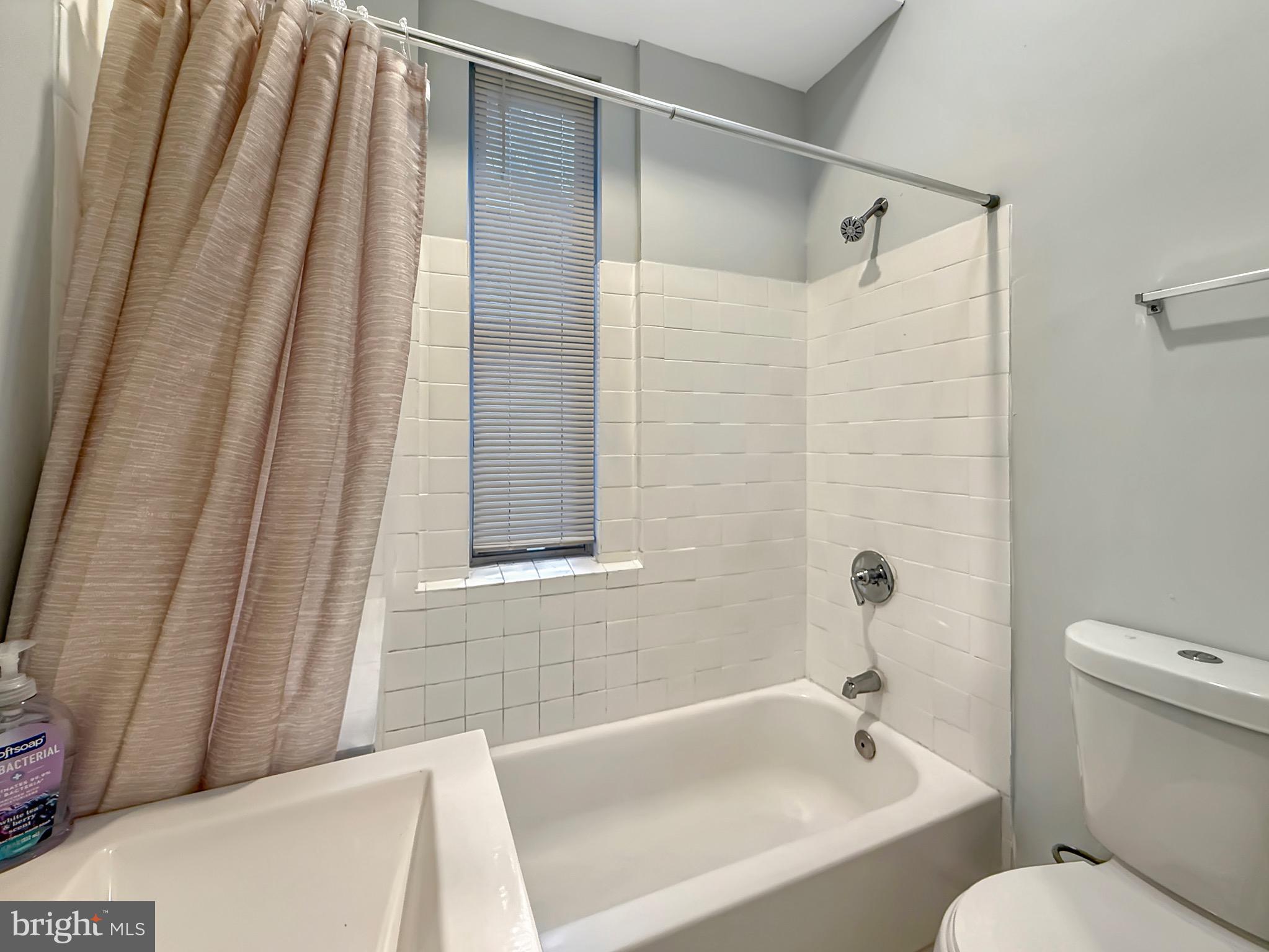 135 East North Avenue, Unit 2 Baltimore, MD 21202 - Photo 19 of 29 a bathroom with a sink and a bathtub