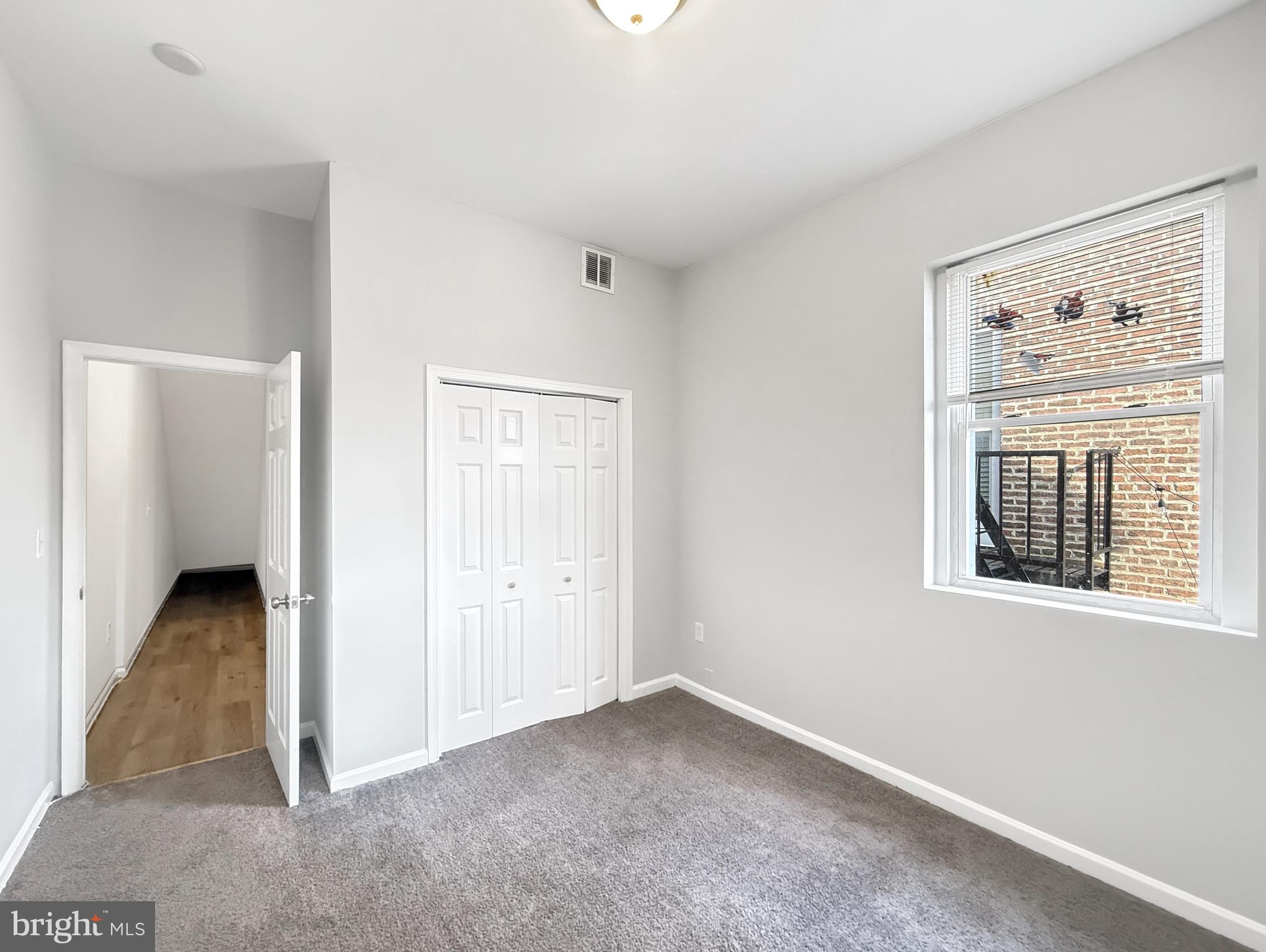 135 East North Avenue, Unit 2 Baltimore, MD 21202 - Photo 20 of 29 an empty room with windows