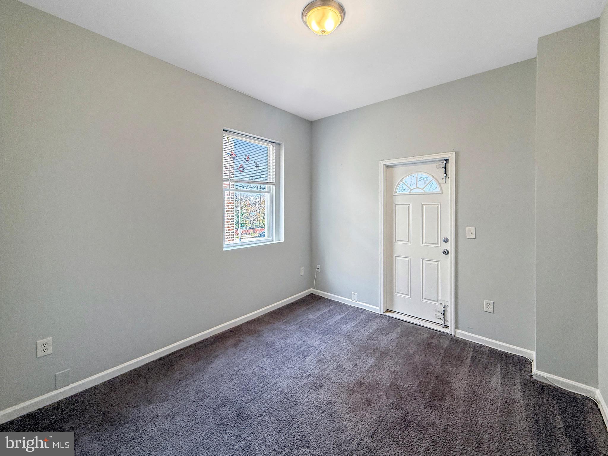 135 East North Avenue, Unit 2 Baltimore, MD 21202 - Photo 22 of 29 an empty room with a window and closet