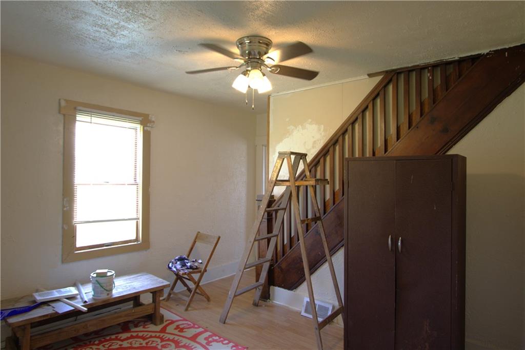 233 Allen Avenue Donora, PA 15033 - Photo 8 of 31 Separate 12x12 Formal Dining Room or 1st Floor Family Room w/ Ceiling Fan Light w/ Door to 12x5 Enclosed Sun Porch