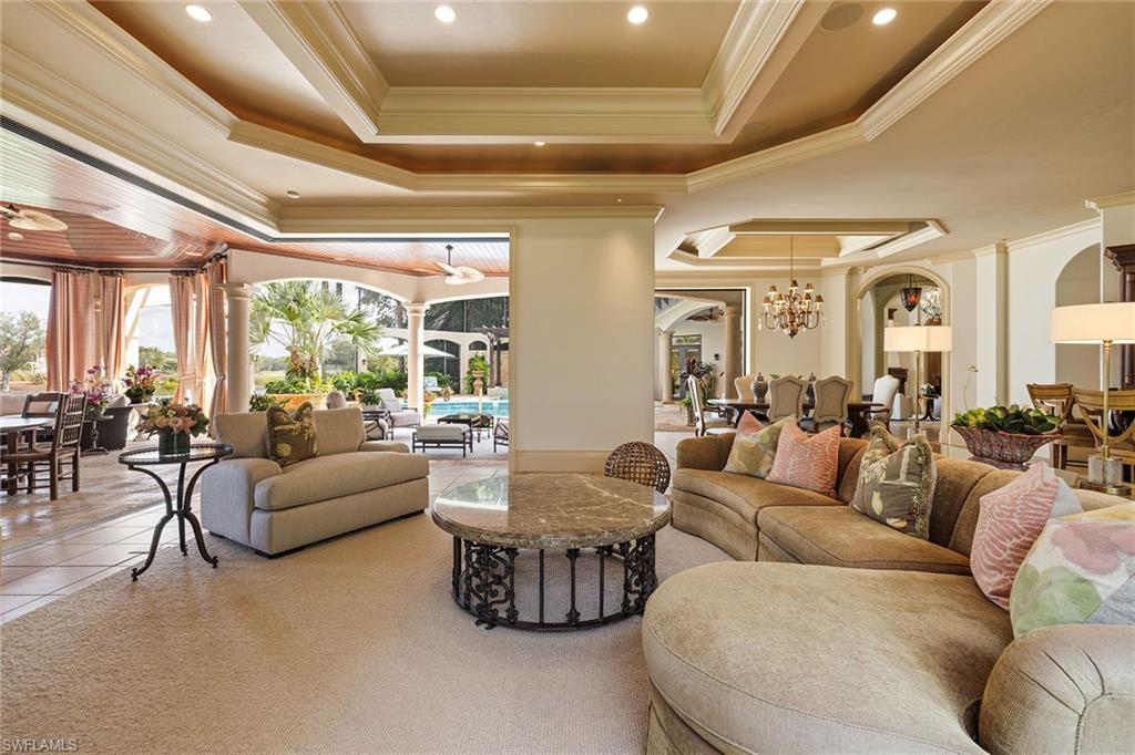 15167 Brolio Lane Naples, FL 34110 - Photo 1 of 50 a living room with furniture and a large window