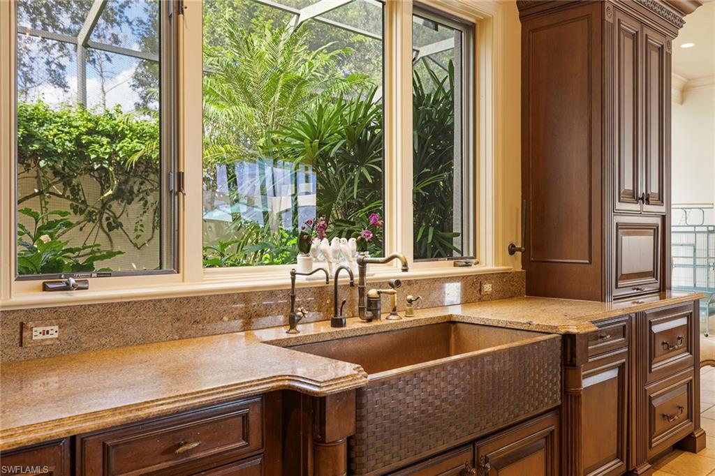 15167 Brolio Lane Naples, FL 34110 - Photo 12 of 50 a kitchen sink sitting next to a window