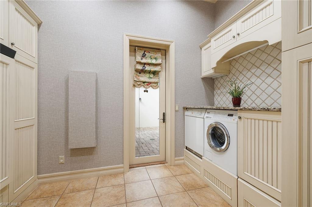 15167 Brolio Lane Naples, FL 34110 - Photo 16 of 50 a utility room with dryer and washer