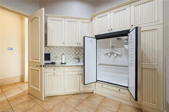 a spacious bathroom with a double vanity sink and a mirror