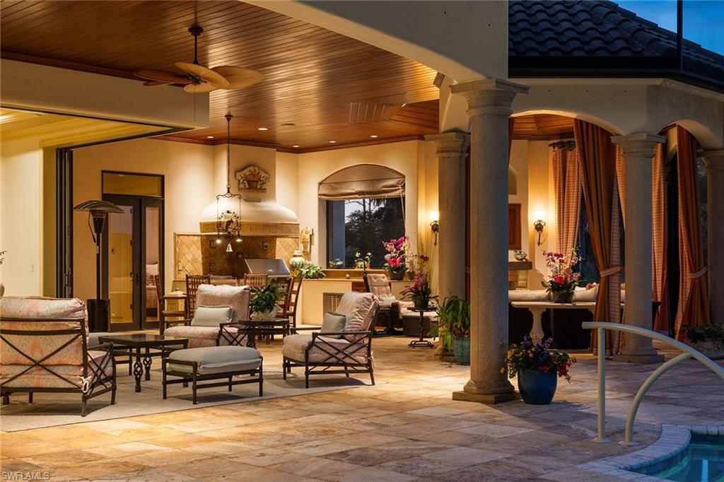 15167 Brolio Lane Naples, FL 34110 - Photo 2 of 50 a living room with furniture and wooden floor