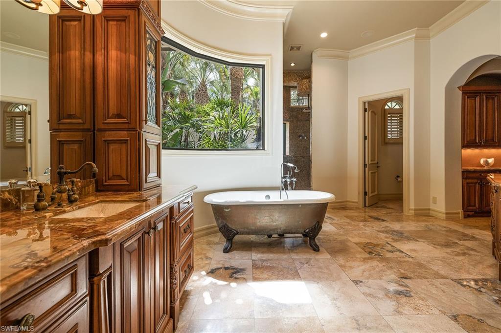 15167 Brolio Lane Naples, FL 34110 - Photo 21 of 50 a bathroom with a sink toilet and shower