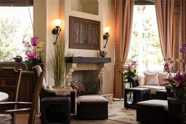 a living room with furniture a rug and a fireplace