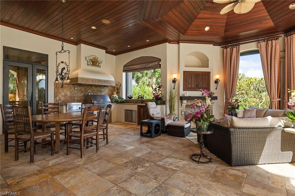15167 Brolio Lane Naples, FL 34110 - Photo 40 of 50 a view of a dining room with furniture window and outside view