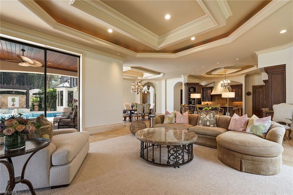 15167 Brolio Lane Naples, FL 34110 - Photo 4 of 50 a living room with furniture and a large window