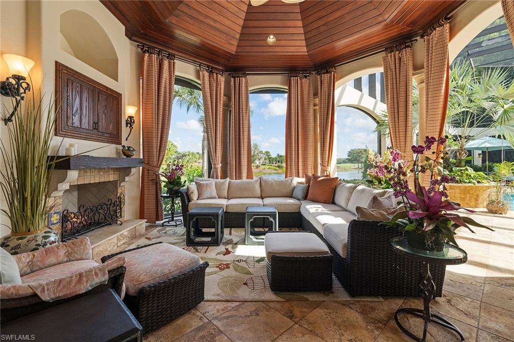 15167 Brolio Lane Naples, FL 34110 - Photo 41 of 50 a living room with furniture and a large window