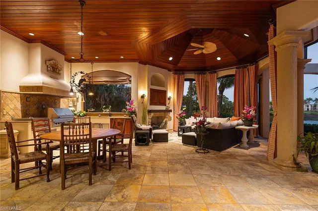a kitchen with stainless steel appliances granite countertop a sink and a refrigerator