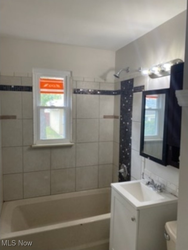 13206 Rockside Road Garfield Heights, OH 44125 - Photo 11 of 15 Bathroom with vanity and washtub / shower combination