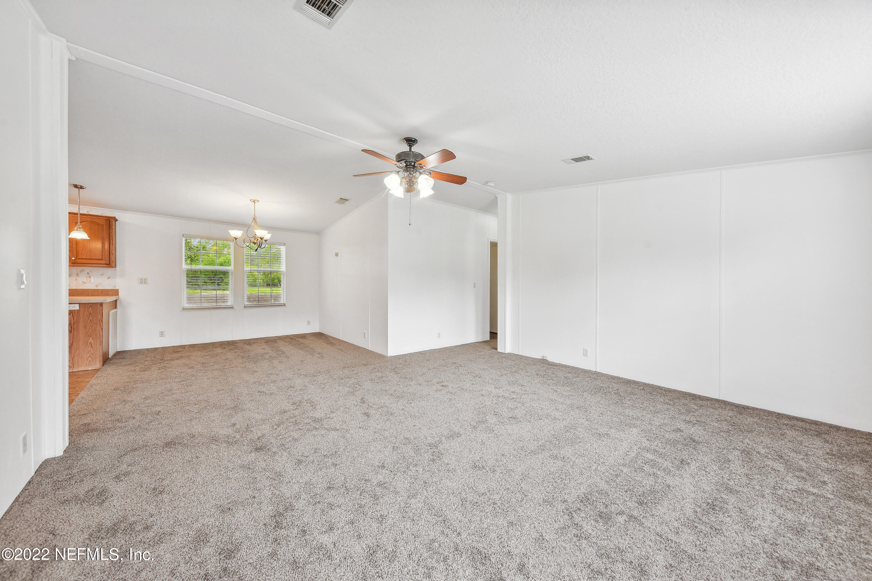 836 Halsema Road South Jacksonville, FL 32221 - Photo 12 of 31 an empty room with windows and fan