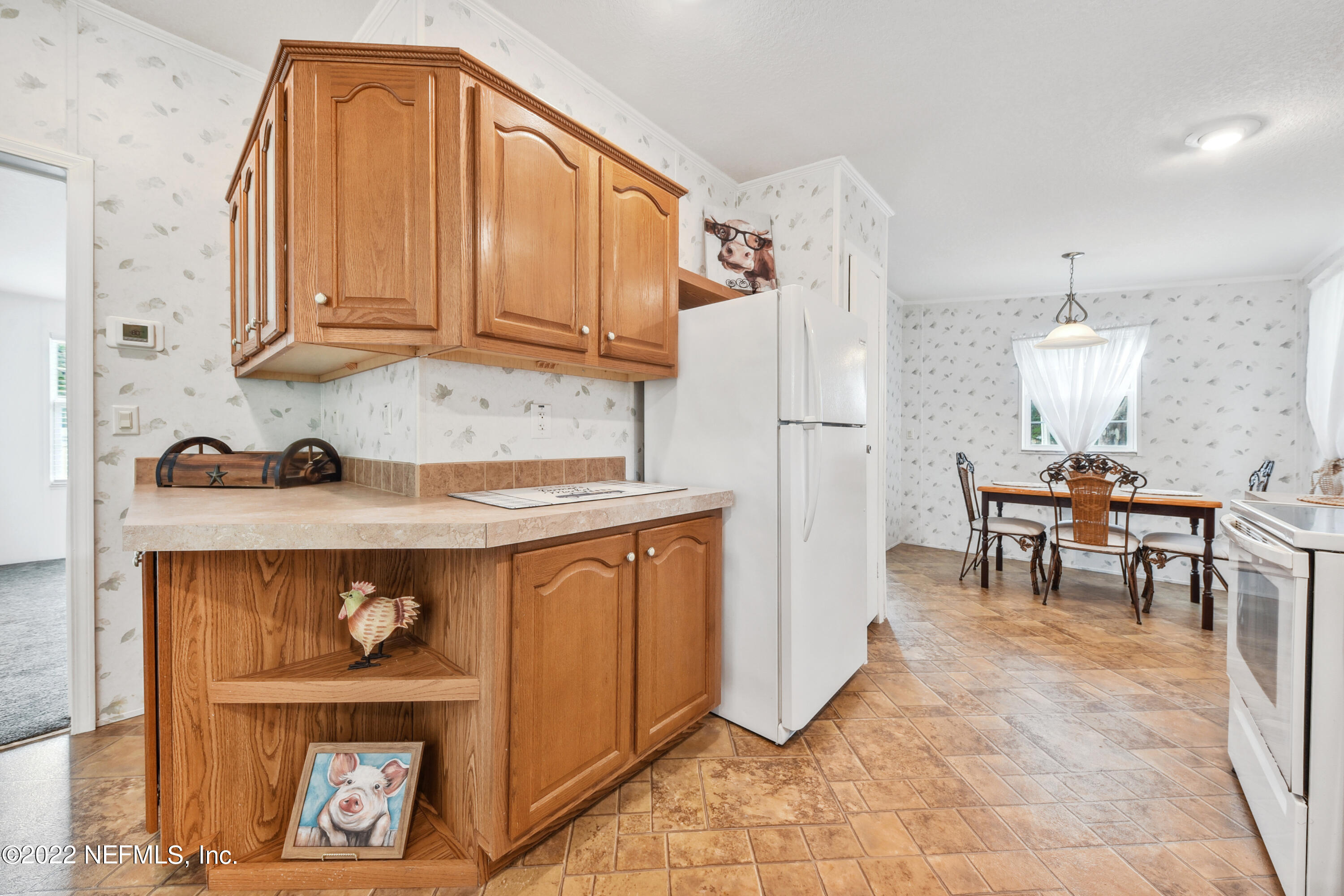 836 Halsema Road South Jacksonville, FL 32221 - Photo 15 of 31 a kitchen with stainless steel appliances granite countertop a refrigerator and a stove top oven
