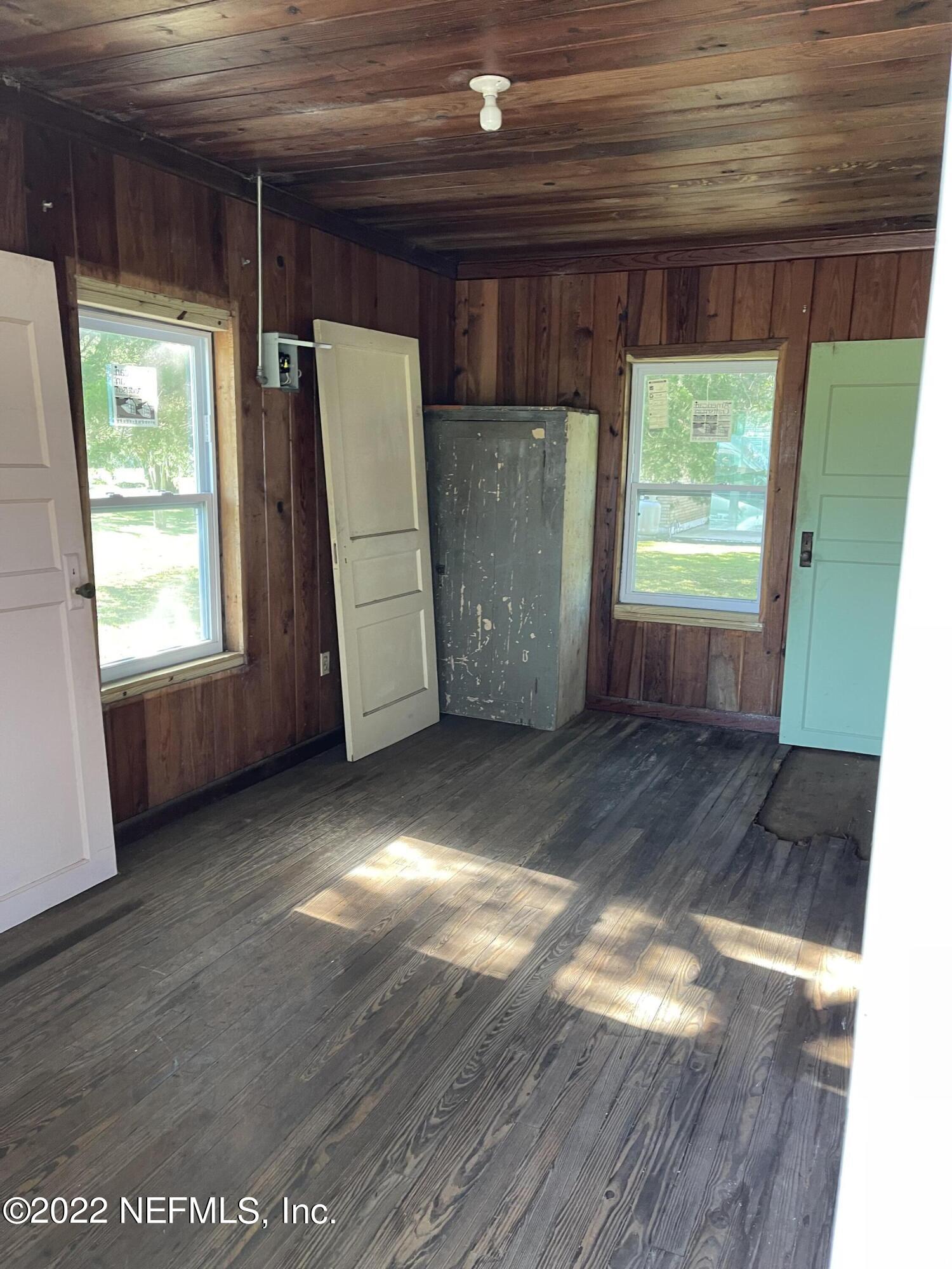 836 Halsema Road South Jacksonville, FL 32221 - Photo 26 of 31 a view of a room with a large window and wooden floor