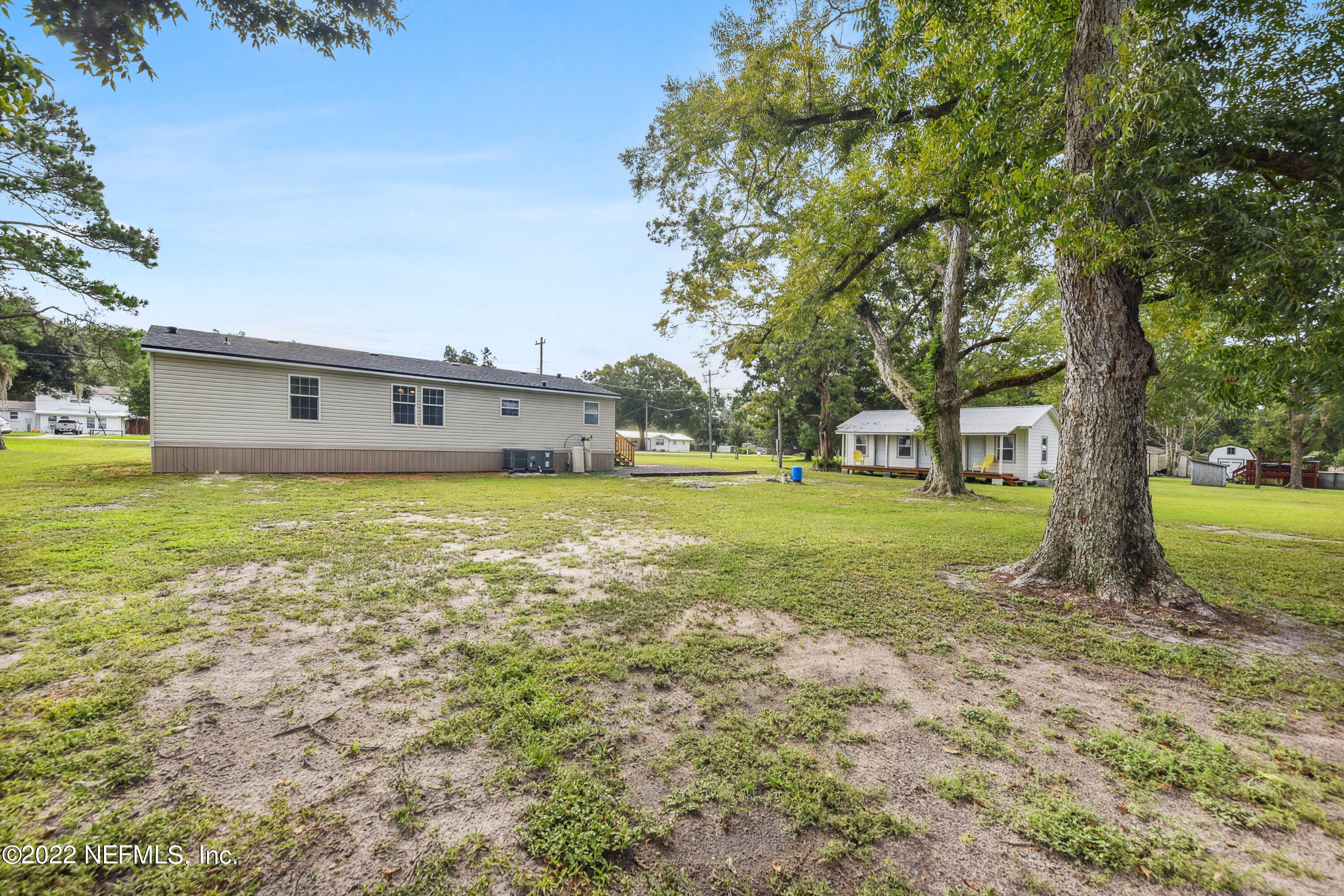 836 Halsema Road South Jacksonville, FL 32221 - Photo 27 of 31 a view of a house with a big yard