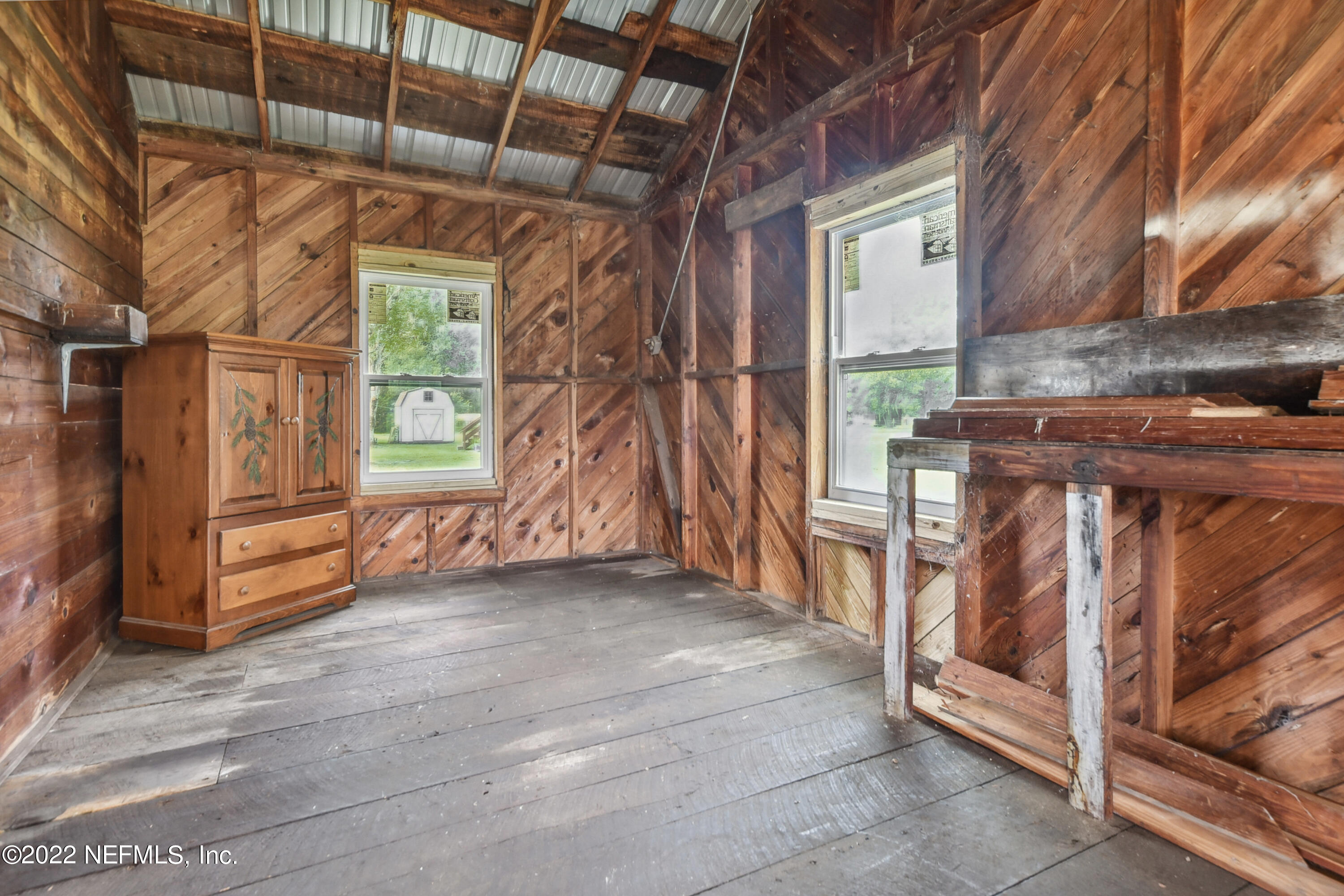 836 Halsema Road South Jacksonville, FL 32221 - Photo 28 of 31 a view of a room with wooden walls and roof