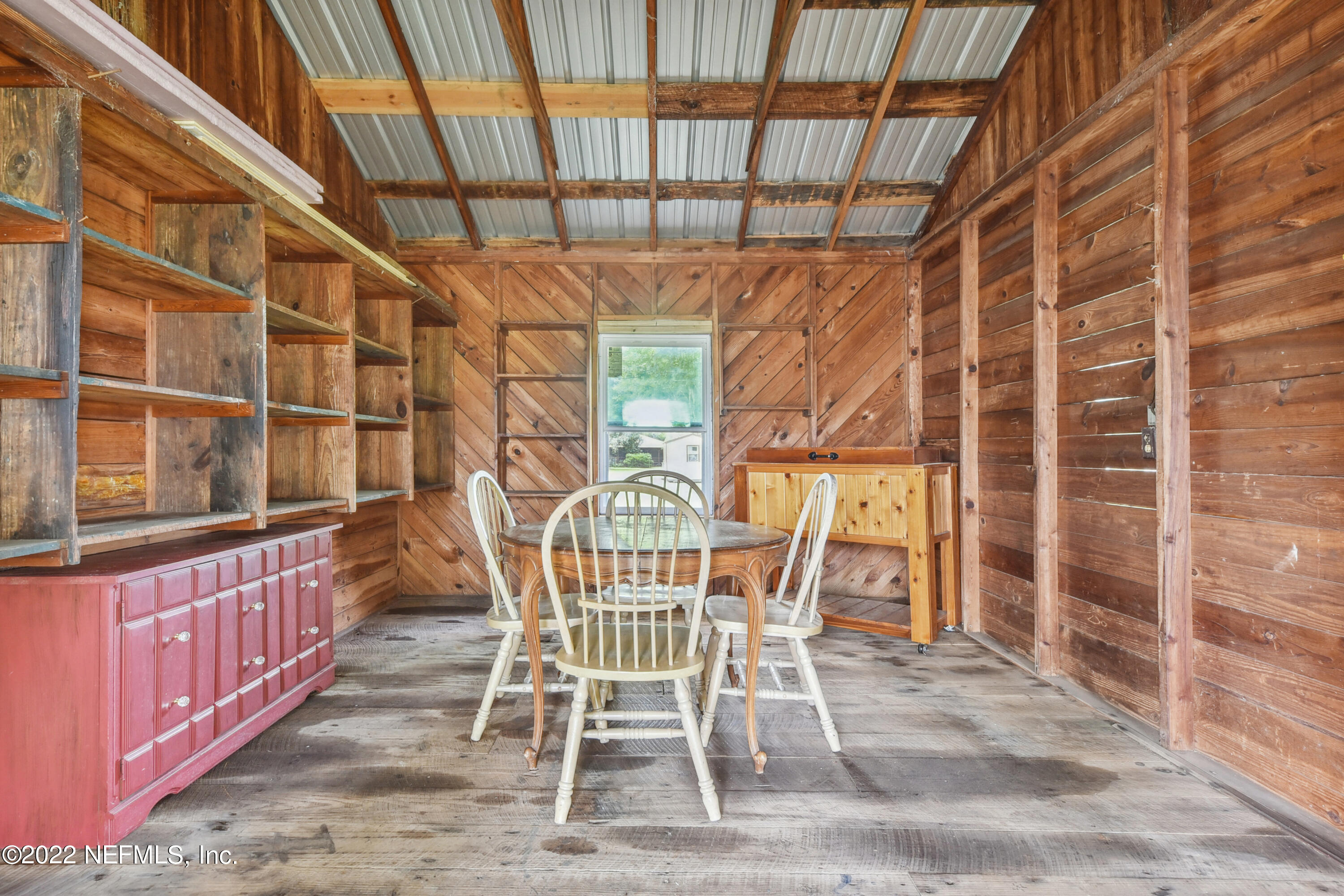 836 Halsema Road South Jacksonville, FL 32221 - Photo 29 of 31 a view of a dining room with furniture and a chandelier