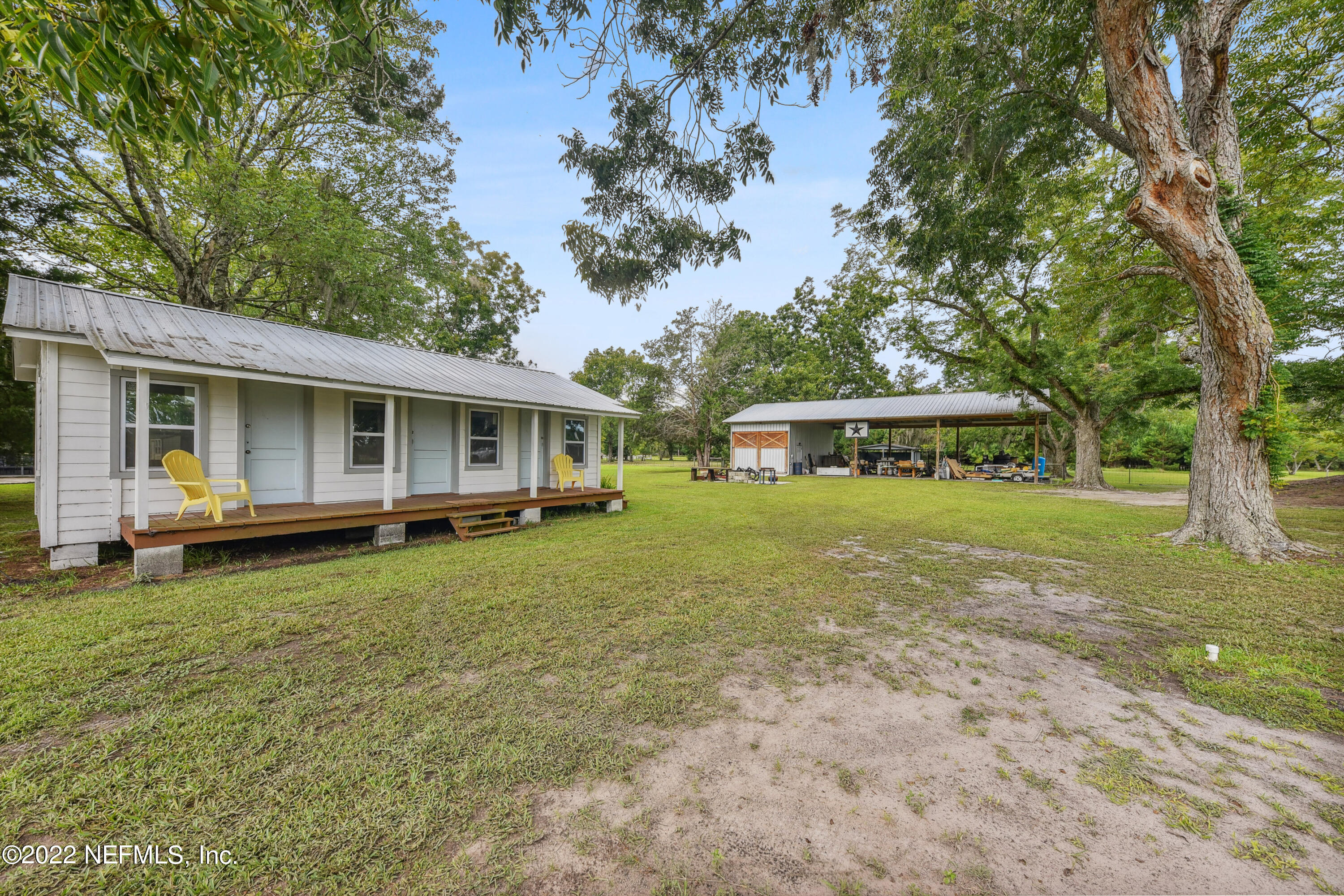 836 Halsema Road South Jacksonville, FL 32221 - Photo 30 of 31 a front view of house with yard and trees in the background