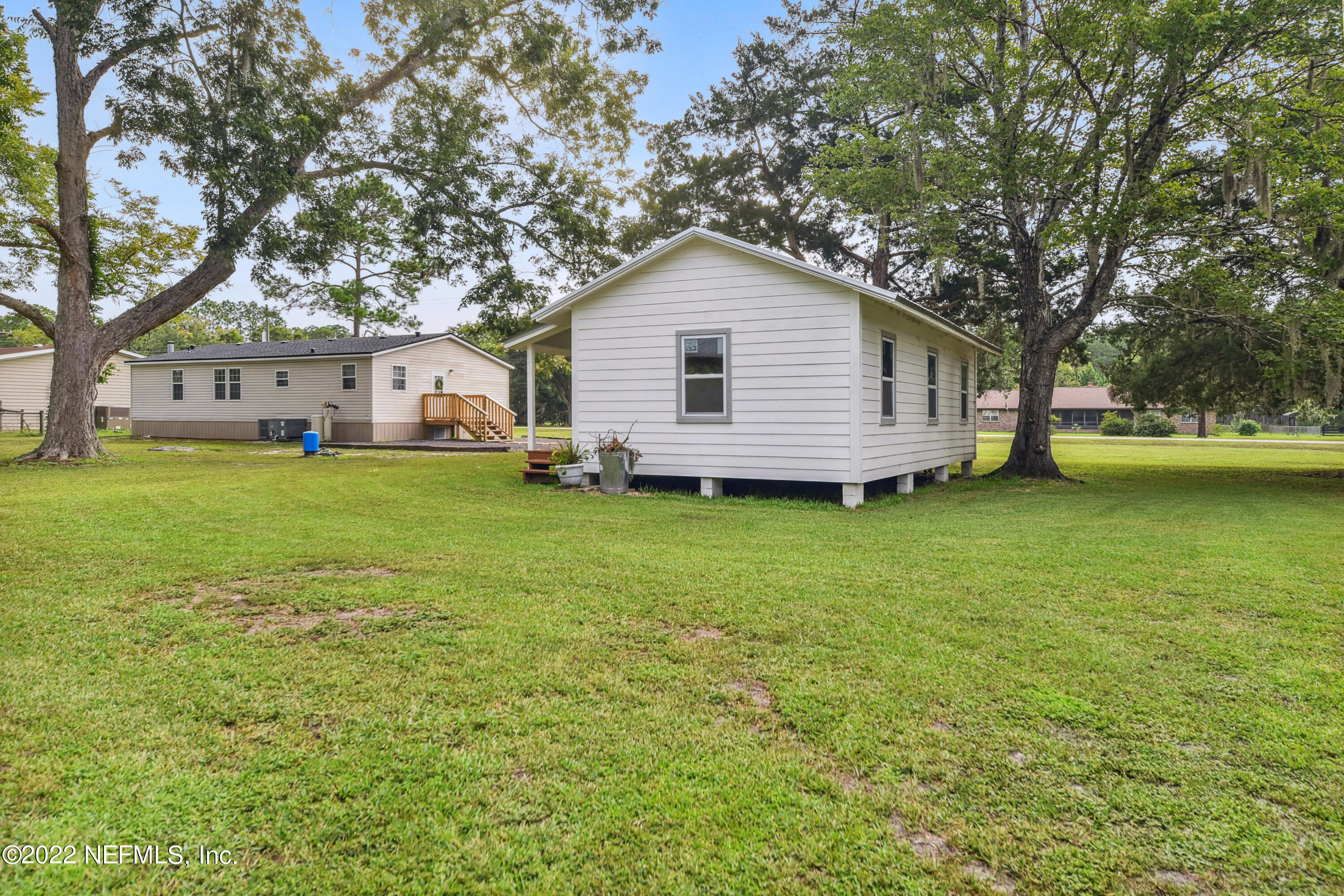 836 Halsema Road South Jacksonville, FL 32221 - Photo 31 of 31 a view of a house with a yard and sitting area