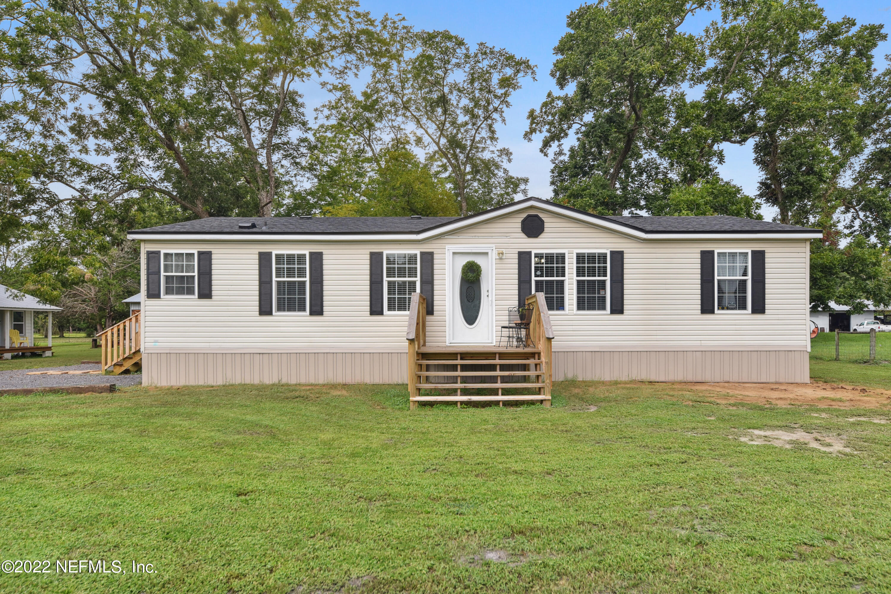 836 Halsema Road South Jacksonville, FL 32221 - Photo 4 of 31 a front view of a house with a garden