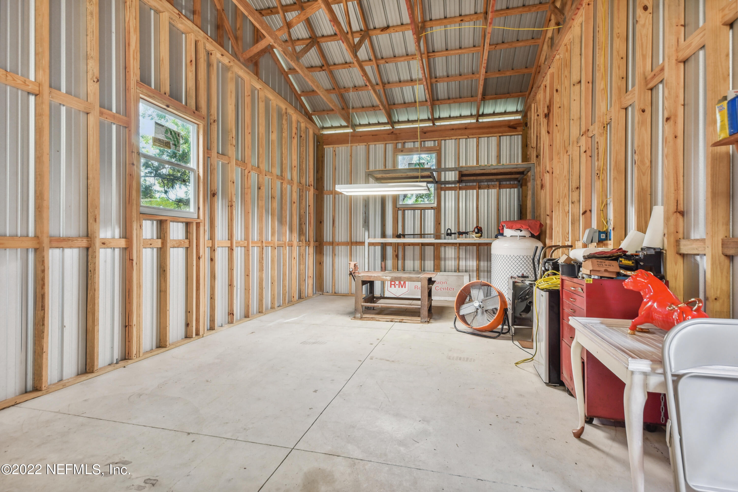 836 Halsema Road South Jacksonville, FL 32221 - Photo 8 of 31 a view of a bedroom with furniture and a window
