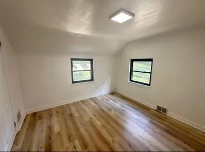 a view of an empty room and window