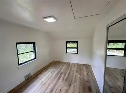 a view of empty room with windows