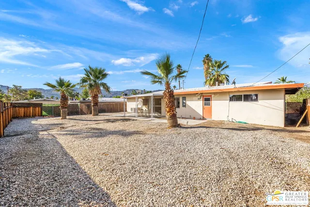 a view of a backyard with a patio