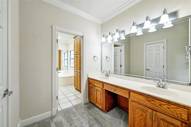 a spacious bathroom with a granite countertop sink a mirror and a shower