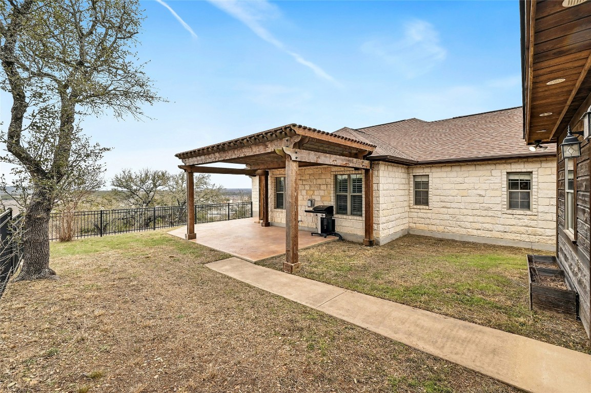 211 Summit Ridge Road Burnet, TX 78611 - Photo 23 of 35 a view of a house with a yard and large tree