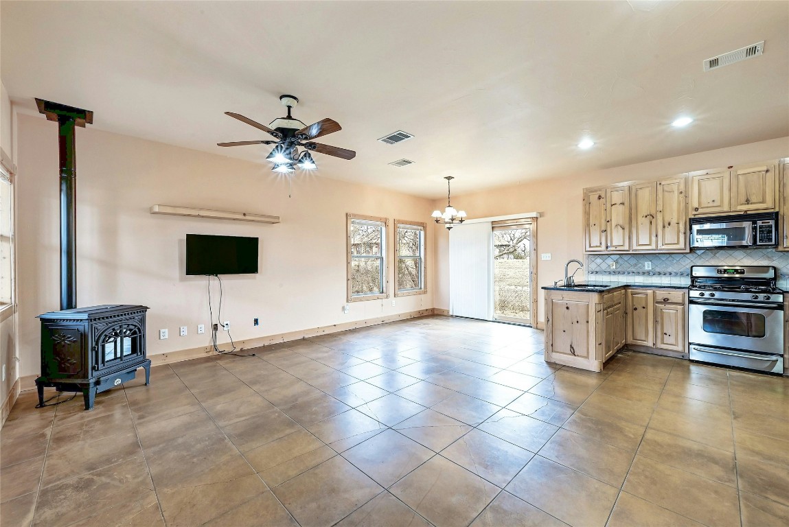 211 Summit Ridge Road Burnet, TX 78611 - Photo 29 of 35 a open kitchen with cabinets and stainless steel appliances