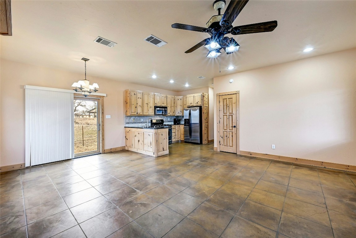 211 Summit Ridge Road Burnet, TX 78611 - Photo 30 of 35 a view of a kitchen with a stove cabinets and a kitchen
