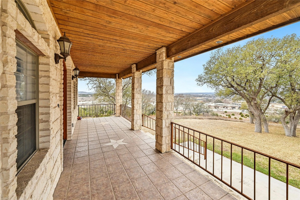 211 Summit Ridge Road Burnet, TX 78611 - Photo 3 of 35 a view of a porch with wooden floor and outdoor space