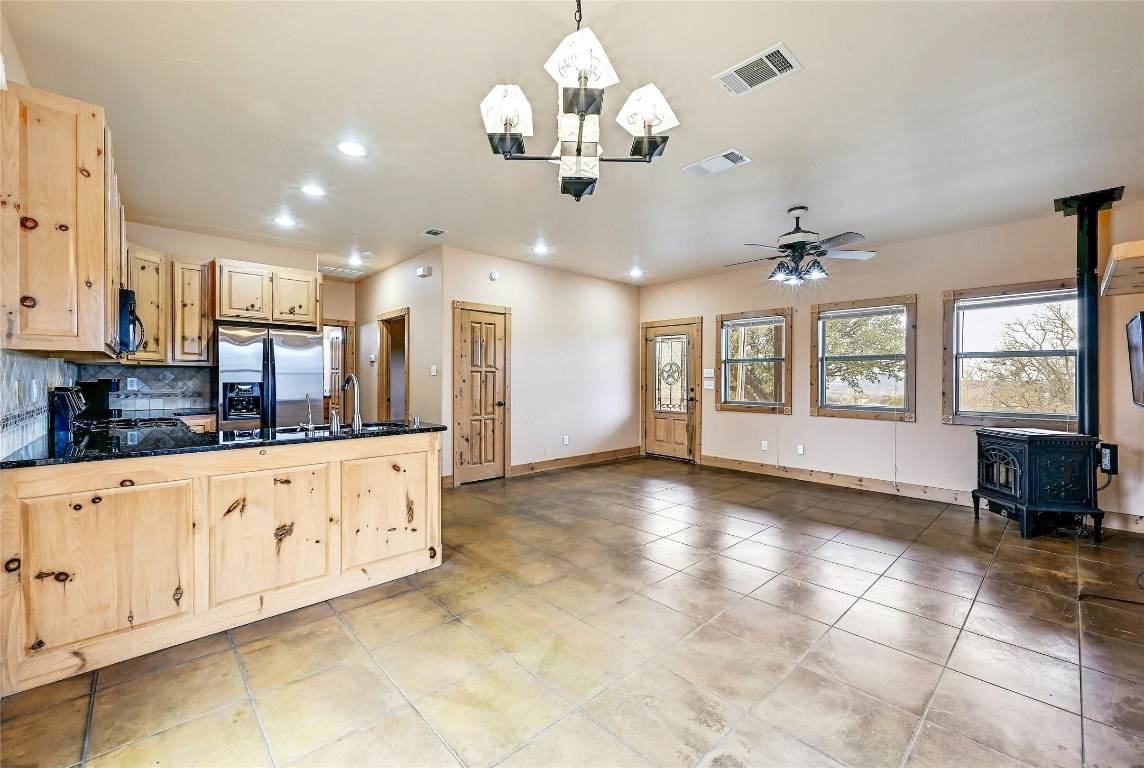 211 Summit Ridge Road Burnet, TX 78611 - Photo 31 of 35 a large kitchen with stainless steel appliances granite countertop a stove and a white cabinets