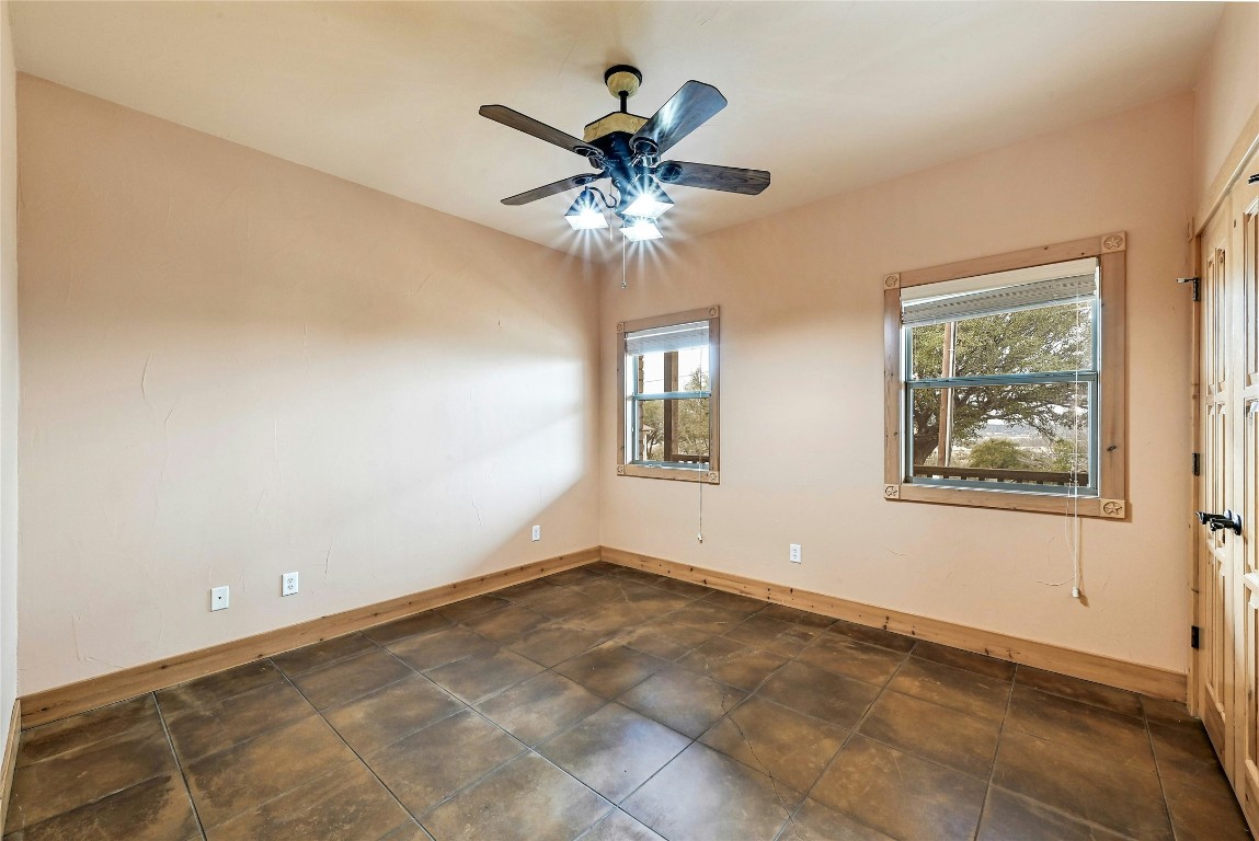 211 Summit Ridge Road Burnet, TX 78611 - Photo 33 of 35 a view of a livingroom with a ceiling fan and a window