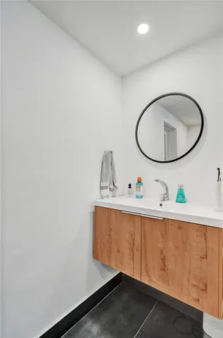 a bathroom with a sink and a mirror