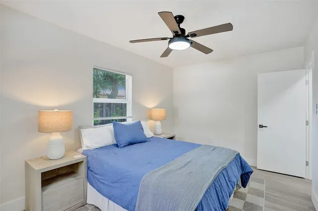 a bedroom with a bed and window