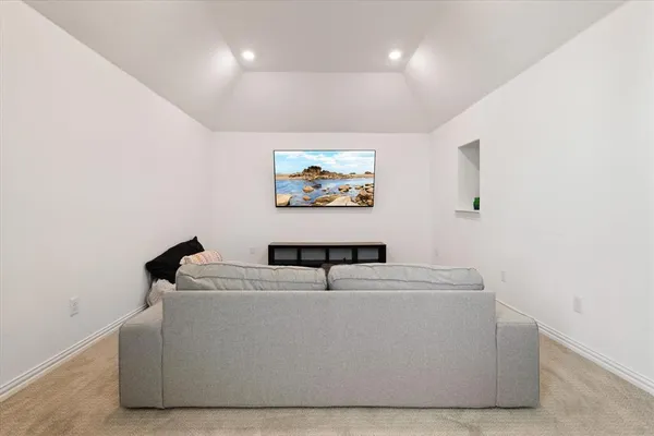 a living room with furniture and window