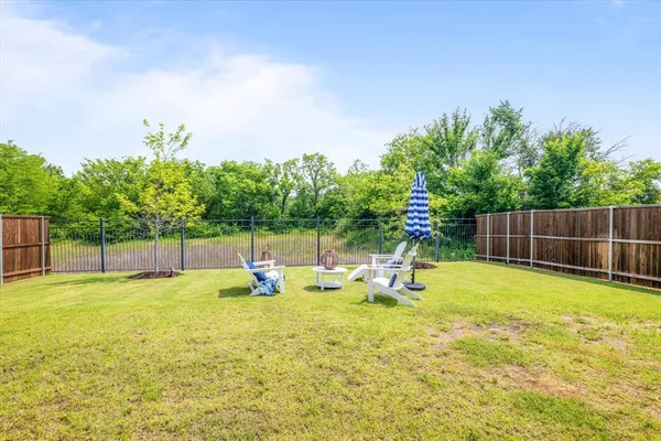 a swimming pool with outdoor seating